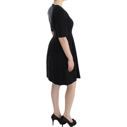 CO|TE Black short sleeve venus dress
