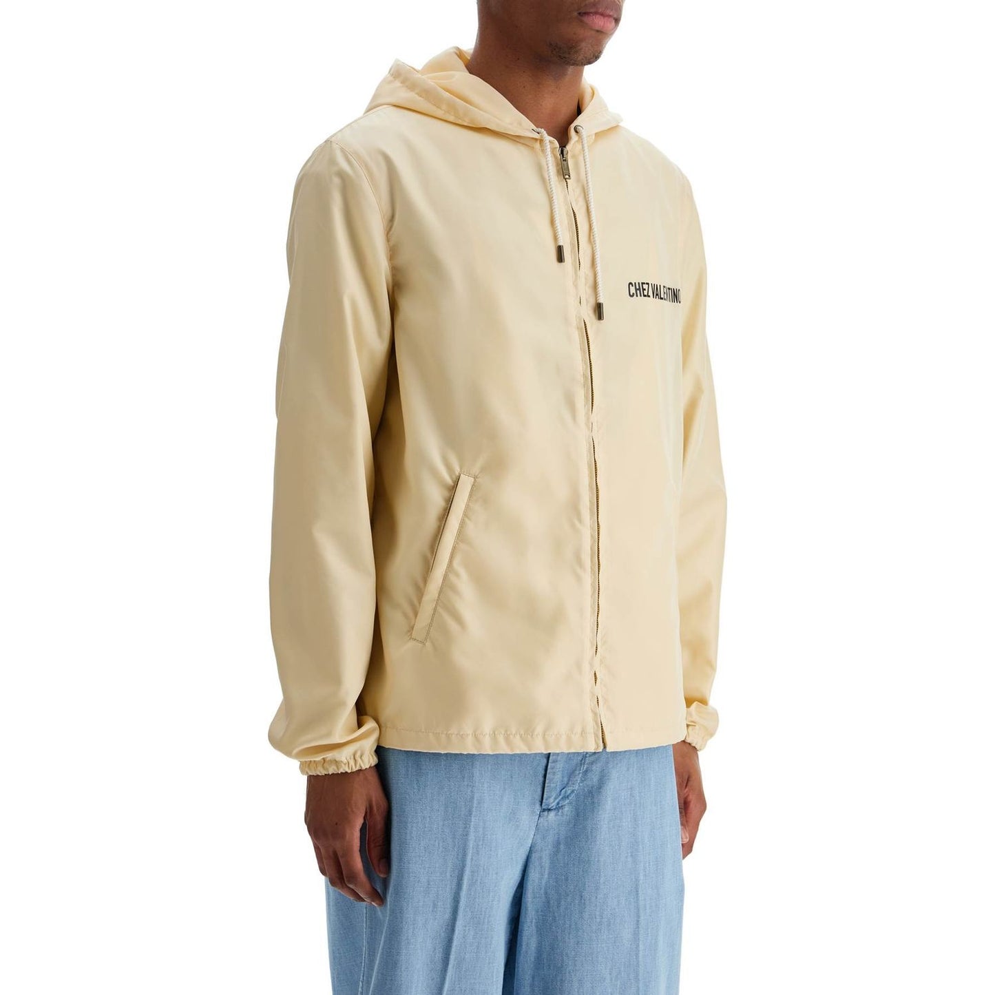 Valentino Garavani beige hooded windbreaker in logoed polyamide Jackets Valentino Garavani